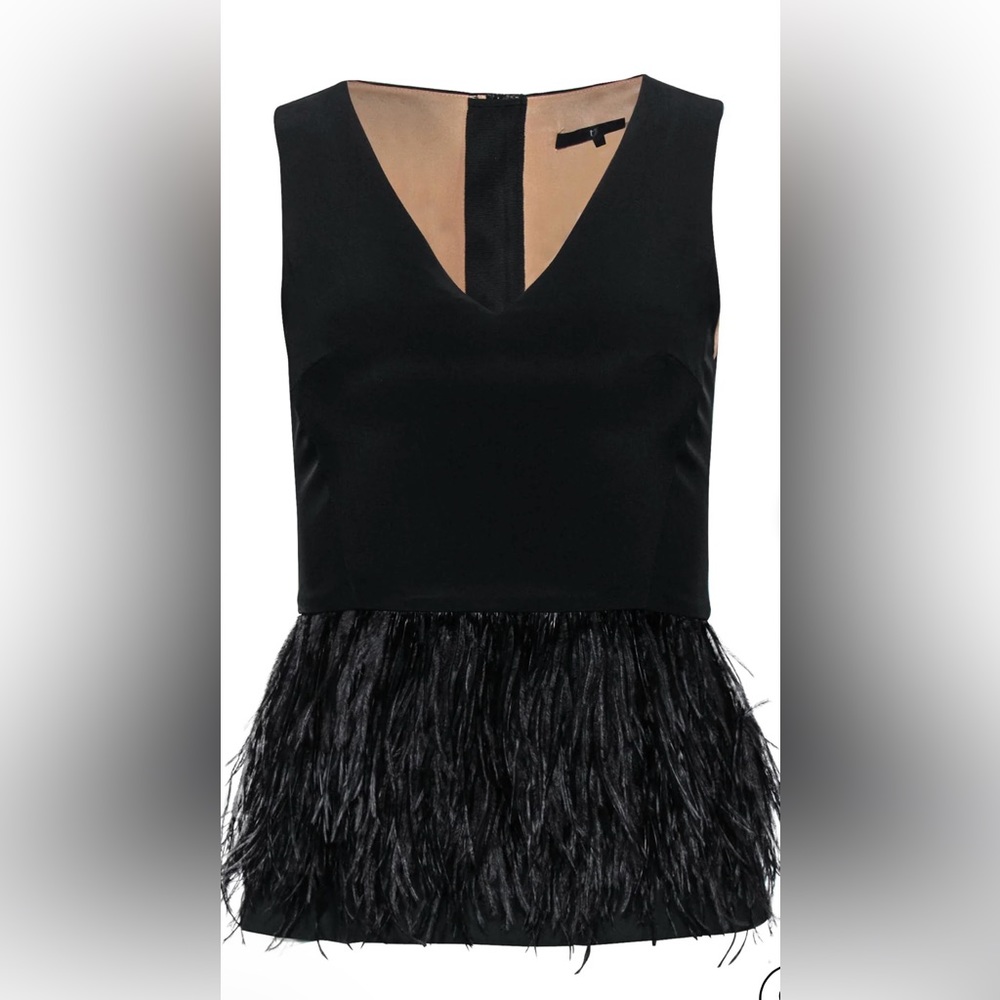 Tibi black sleeveless peplum top with ostrich feathers.Bought from the real real